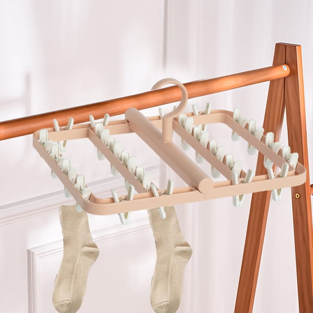 TIMIFIS Drying Rack Hanging Clothes Rack with foldable hanging points and 24 integrated clips, crafted from beige plastic and hanging on a wooden rod. Ideal for laundry room storage, drying socks, underwear, and other small items. Features a 360° rotating hook for easy access and windproof buckles for stability.