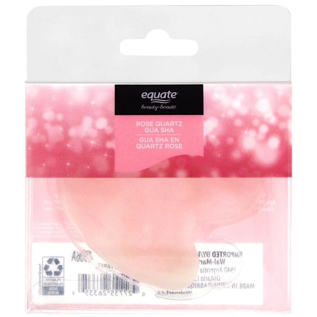 Equate Beauty Rose Quartz Gua Sha facial massage tool in translucent pink rose quartz with smooth curved edges, packaged in clear plastic with a pink and black label showing the brand and product name in English and French, suitable for stimulating circulation and reducing facial puffiness.