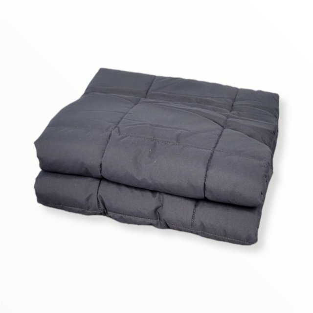Cotton House 12-pound weighted blanket in dark gray, measuring 48 inches by 72 inches. The blanket features a quilted design with evenly distributed stitching for balanced pressure. It is folded neatly, showcasing its soft and smooth texture, ideal for reducing stress and improving sleep quality.