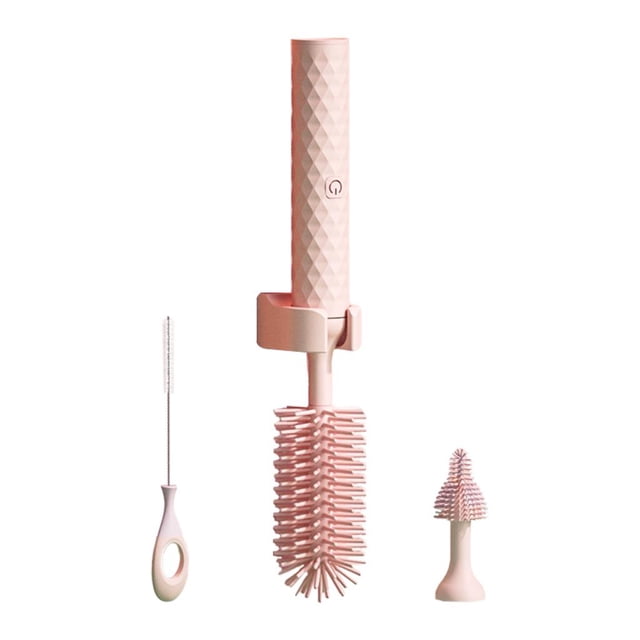 Multifunctional Electric Baby Bottle Brush Clean Set for Newborn, featuring a handheld electric cleaning tool with a rechargeable 1200mAh battery. Includes a high-density silicone brush for scratch-free 360-degree cleaning, a hand brush, and a base. Made of soft, elastic silicone material suitable for cleaning milk bottles, cups, and vacuum cups. The set is shown in a light pink color with a textured handle and includes a charging cable and manual.