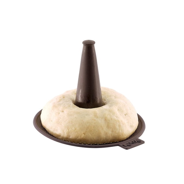 Lekue Brown Bagel Maker small silicone mould with dough shaped around a central conical tip for easy handling and maintaining bagel shape during boiling, featuring micro-perforations for water drainage and crispier bagels, ideal bakeware for homemade bagels.