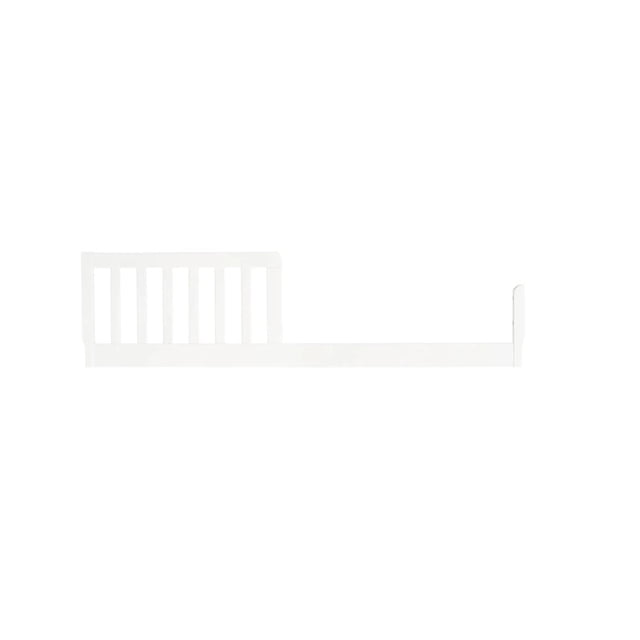 Concord Baby Universal Toddler Guard Rail in white solid wood with vertical slats on one end and a long horizontal rail with a vertical end piece, featuring a non-toxic finish and designed as a safety barrier to convert compatible Concord Baby cribs into toddler beds.