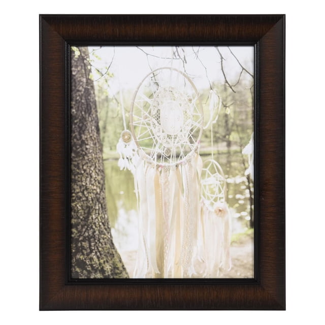 hometrends Lynnwood Smoked Cognac Picture Frame with rich dark cherry finish holding an 8 by 10 inch photo of white dreamcatchers hanging from tree branches near a lake, featuring glass protection and suitable for horizontal or vertical display
