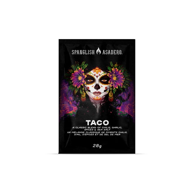 Spanglish Taco Seasoning, 28g, black packet with vibrant purple and yellow floral artwork on each side, featuring white text describing a classic blend of chili, garlic, spices, and sea salt for authentic taco flavor.