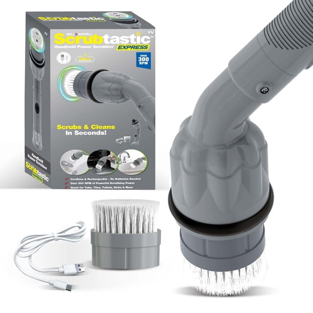 Bell + Howell Scrubtastic Express Dark Grey Rechargeable Handheld Power Scrubber with round brush head attached, extra flat brush head, and USB charging cable displayed beside its packaging highlighting over 300 RPM cordless scrubbing power for bathroom and kitchen surfaces, suitable for tubs, tiles, toilets, and sinks.