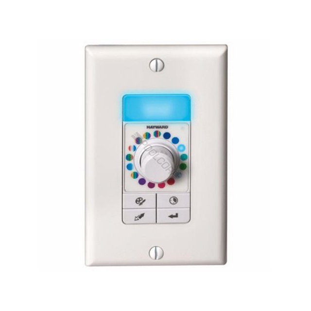 Hayward Produits pour Piscine LKCUS1100 UCL Commande Lumineuse Autonome pour Piscines, Présentant un design Multicolore avec un Bouton de Commande central Entouré d'Un Anneau de Sélection de Couleur et des Boutons de Commande Supplémentaires. l'Unité Est Montée sur un Panneau Rectangulaire Blanc avec un Écran Rétroéclairé Bleu. Convient aux Systèmes d'Éclairage de Piscine Extérieurs.
