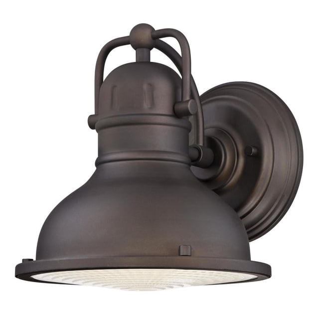 Westinghouse Orson 1-Light Integrated LED Oil Rubbed Bronze Outdoor Wall Fixture featuring a bell-shaped steel shade with oil rubbed bronze finish, frosted prismatic lens, and integrated 9 watt LED for energy-efficient porch or patio illumination, also suitable for deck lighting.