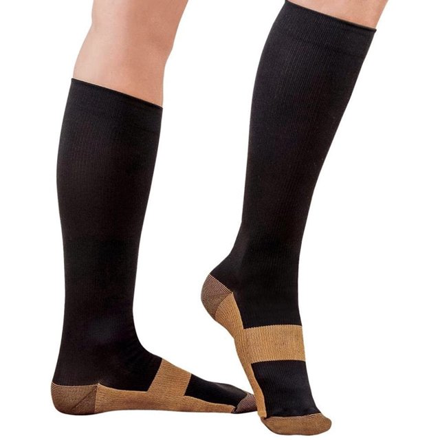 Copper Compression Socks For Men and Women 15-20mmhg Knee High. Black knee-high socks with copper-colored accents on the heel, toe, and arch. Designed to relieve leg aches, reduce muscle fatigue, and assist with recovery after exercise. Suitable for nurses, teachers, athletes, and travelers. Available in multiple sizes for men and women.