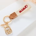 thumbnail image 1 of Short Fabric Embroidered Keychain for Mother's Day, Handmade Crochet Design with Leather Details, Measuring 15.5x3x1cm, Ideal as Key Accessory or Gift, 1 of 6