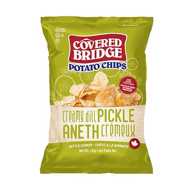 Covered Bridge - Creamy Dill, 170g kettle-cooked potato chips bag in green packaging featuring crispy chips with creamy dill pickle flavor, gluten-free and made in Canada, labeled in English and French with a maple leaf icon, suitable for snacking at home or on the go.