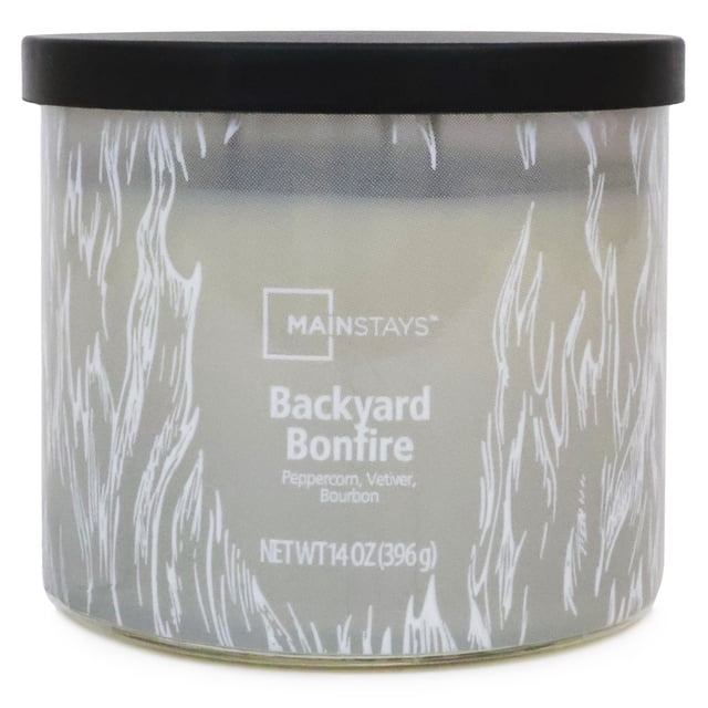 Mainstays 3-Wick Textured Wrapped Backyard Bonfire Scented Candle, 14 oz, in a frosted glass jar with white flame patterns and a black lid, scented with peppercorn, vetiver, and bourbon, suitable for enhancing indoor relaxation and ambiance.