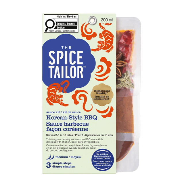 The Spice Tailor Korean BBQ sauce kit 200 mL in a beige box with blue logo and orange tiger designs, featuring medium heat and three simple steps to prepare restaurant-quality Korean-style BBQ sauce, suitable for chicken, beef, pork, or vegetables, with no artificial flavours, colours, or preservatives.