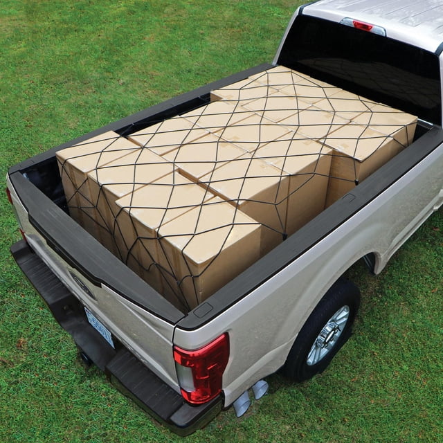Rightline Bungee Cargo Net stretched over a silver full-size pickup truck bed loaded with sealed cardboard boxes, featuring black elastic cords in a grid secured by rigid, relocatable hooks that adjust tension and fit all truck bed sizes for secure cargo management.