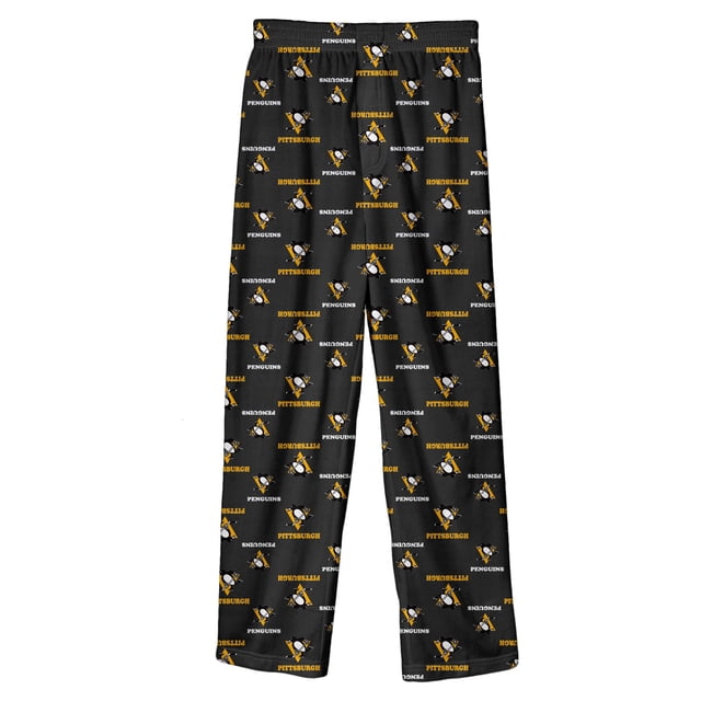 Pantalon de Pyjama à Imprimé Intégral pour Jeunes Pittsburgh Penguins Taille 18/20, avec Graphiques d'Équipe Sublimés et un design à Imprimé Intégral Audacieux en Couleurs d'Équipe. Ces Pantalons en polyester Noir Ont une Taille Élastique pour le Confort, une Fausse Braguette avant, et Sans Poches Ni Cordon de Serrage. Fabriqués en Matériau Résistant aux Flammes, Ils Sont Lavables à la machine et Importés.
