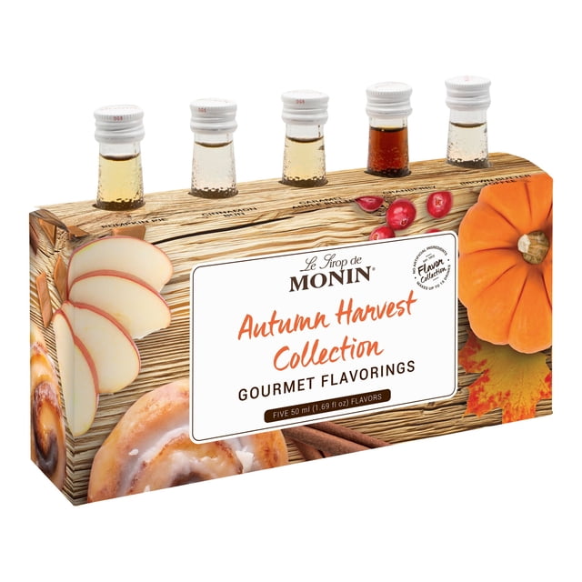 Monin Mini Autumn Harvest Collection Syrups 1.7 oz. each, a 5-pack of gourmet fall flavors including pumpkin pie, cinnamon bun, caramel apple butter, cranberry, and brown butter toffee. Made with natural flavors, gluten-free, non-GMO, and kosher, this sampler pack is displayed in a decorative box with autumn-themed imagery such as pumpkins, apples, and cranberries. Perfect for cocktails, mocktails, teas, and coffees.