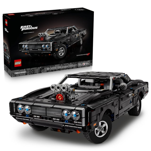 LEGO Technic Fast and Furious Dodge Charger R/T Car - Building Set for Adults, Ages 18+ - Collectible Model Car Kit for Fans - Detailed Features - Gift for Birthdays - 42231 front-facing view of the assembled model showing the long black-and-dark-gray Dodge Charger silhouette, V8 engine with chain-driven compressor, rear-wheel drive with cardan shaft and differential, independent front and rear suspension, rear steering knob, two NOS bottles and a fire extinguisher, 1,516 pieces, 16 in. (40 cm) long, displayed on a neutral shelf; often used as a desk or shelf centerpiece.