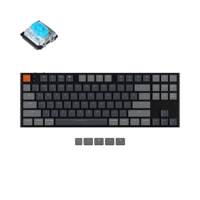 Keychron K1 V2 Wireless Low Profile Mechanical Keyboard in black with TKL layout, RGB backlighting, aluminum frame, and Gateron Blue switches. It has curved matte ABS keycaps, an orange escape key, and extra keycaps for Windows and Mac OS. A close-up of a blue mechanical switch is shown above.