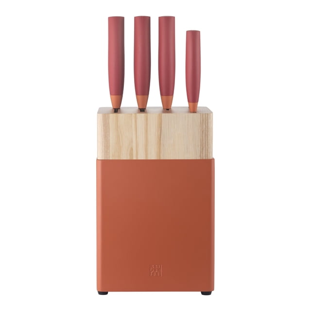 ZWILLING Now S 6 Piece Knife Block Set in orange-red, featuring a modern tone-on-tone design. Includes a 7-inch Chinese chef's knife, 7-inch Santoku knife, 6-inch chopper, 3-inch vegetable knife, 5.5-inch petty knife, and a matching knife block. The block has a natural wood top and an orange-red base, with precision-stamped stainless steel knives that are FRIODUR ice-hardened for durability and sharpness. Ideal for professional and home chefs.