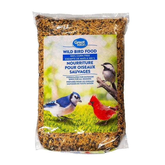 Great Value Wild Bird Food 9kg bag with clear plastic packaging filled with mixed seeds, labeled 100% corn free and formulated for outdoor birds year-round, showing images of a blue jay, cardinal, and chickadee on a green grass background, ideal for feeding wild birds in Canadian gardens.