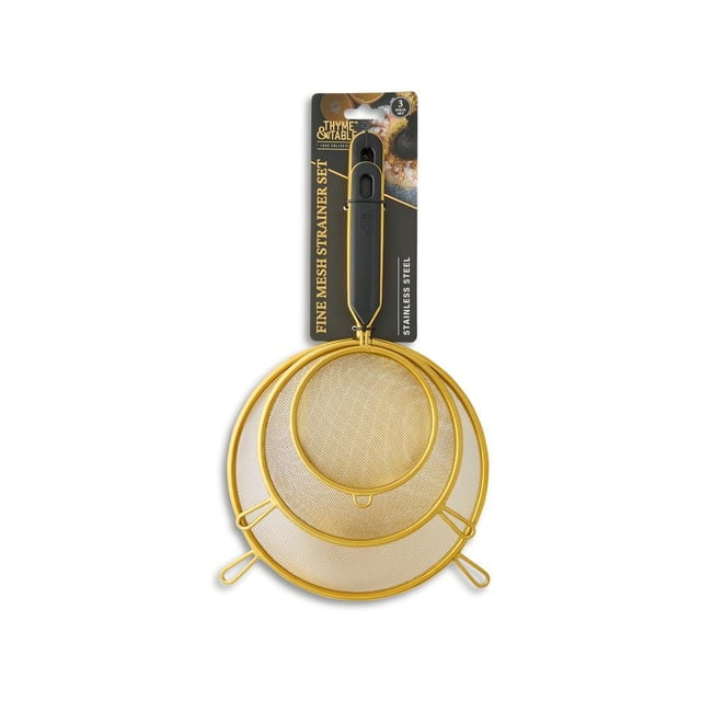 Thyme & Table 3-Piece Fine Mesh Gold Strainer Set with three nested stainless steel strainers featuring fine gold mesh and black ergonomic handles, ideal for sifting flour, draining pasta, and straining sauces, also suitable for rinsing small fruits and herbs.