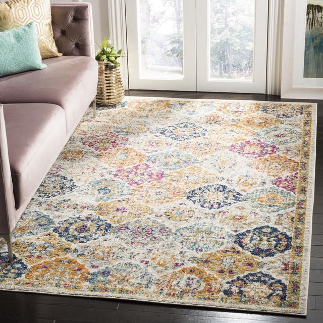 SAFAVIEH Madison Judith Geometric Floral Area Rug with a durable power-loomed multicolored floral and geometric pattern in blue, orange, yellow, and pink on a light background, placed on dark hardwood floor beside a mauve sofa with cushions and a gold-striped vase with greenery near glass doors, ideal for enhancing contemporary home decor.