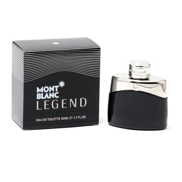 Mont Blanc Legend For Men Eau De Toilette Spray 1.7 OZ with a black curved bottle topped by a reflective silver cap embossed with the Montblanc star emblem, displayed next to its black box featuring white wave lines and bold branding, designed for men seeking an aromatic cologne with fresh pineapple, bergamot, lavender, and earthy cedar notes.