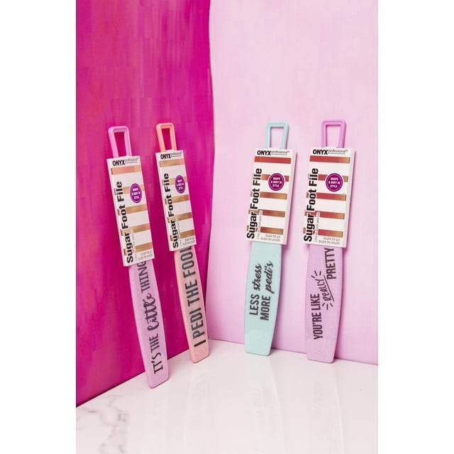 Onyx Professional Sugar Foot File pedicure tool, front-facing handheld foot file with printed quote on the face and visible sugar-grit buffing surface, rectangular tile with textured comfortable grip, shown on neutral background. Wet-or-dry use for removing dry skin and calluses; often used to prep feet before polish.