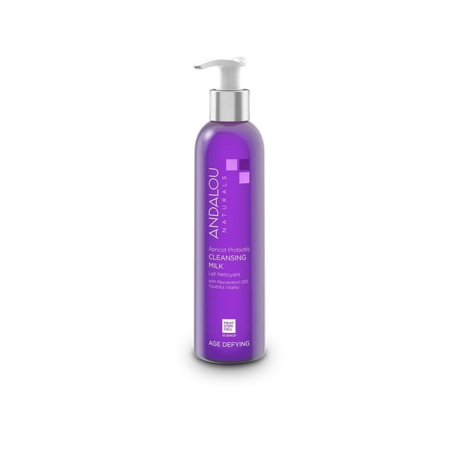 ANDALOU AGE DEFYING Apricot Probiotic Cleansing Milk in a purple pump bottle, formulated with resveratrol Q10 and fruit stem cell science, gently removing makeup and impurities for a hydrated, rejuvenated complexion, suitable as a facial cleanser for dry skin.