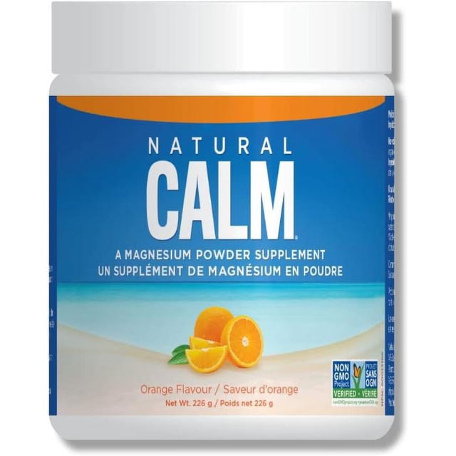 Natural Calm Magnesium Citrate Powder in orange flavour, 226g container. The label features a beach-themed design with sliced oranges and text highlighting it as a magnesium powder supplement. Non-GMO Project Verified and Made Safe Certified logos are visible.