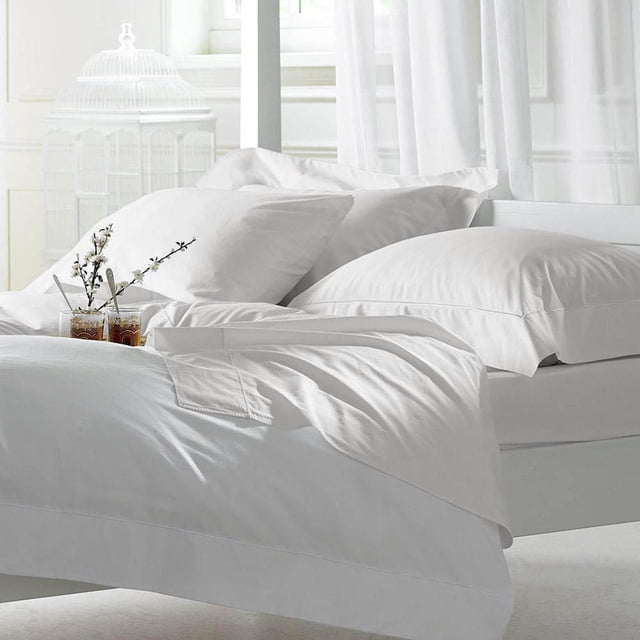 Johnson Home 400 TC Bed Sheet Set - 100% Cotton Sheets in white, featuring smooth, breathable cotton fabric with a sateen finish, displayed on a bed with two pillowcases and a flat sheet in a bright, white bedroom setting with curtains and decorative glass jars with flowers, ideal for year-round comfort.