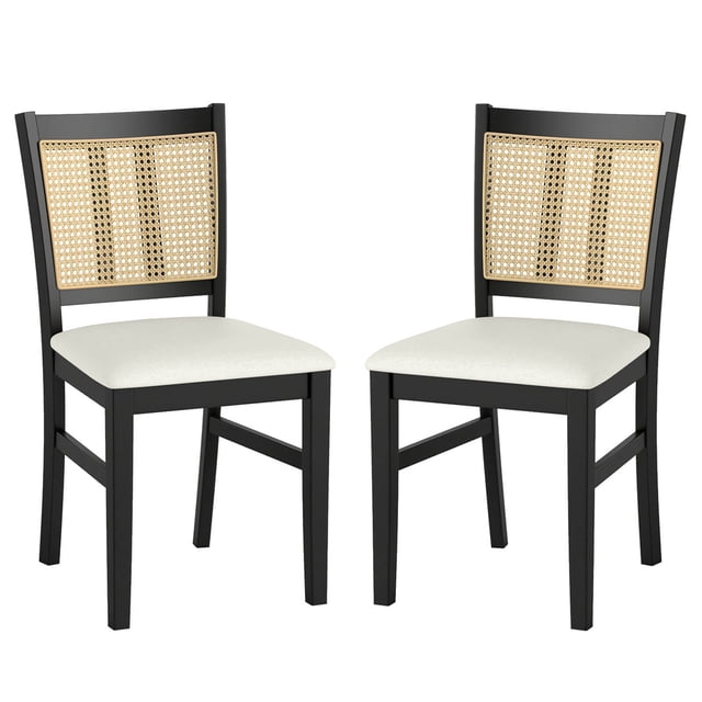 Costway Farmhouse Rattan Dining Chair Set of 2 featuring a robust rubber wood frame in black, beige fabric upholstered seats, and breathable PVC rattan backrests. Each chair measures 17.5 inches wide, 21 inches deep, and 34 inches high, with a weight capacity of 400 lbs. The ergonomic design and natural materials make these chairs suitable for dining rooms, kitchens, or other indoor spaces.