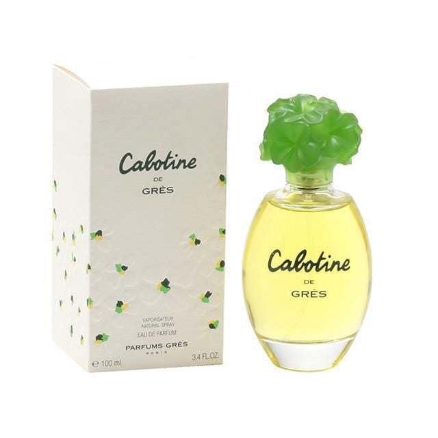 Cabotine by Parfums Gres Eau De Parfum Spray for Women 100ml with a clear oval glass bottle containing yellow fragrance and a green floral cap, next to a white box decorated with small green and yellow flowers and black text, suitable as a classic women's fragrance gift.