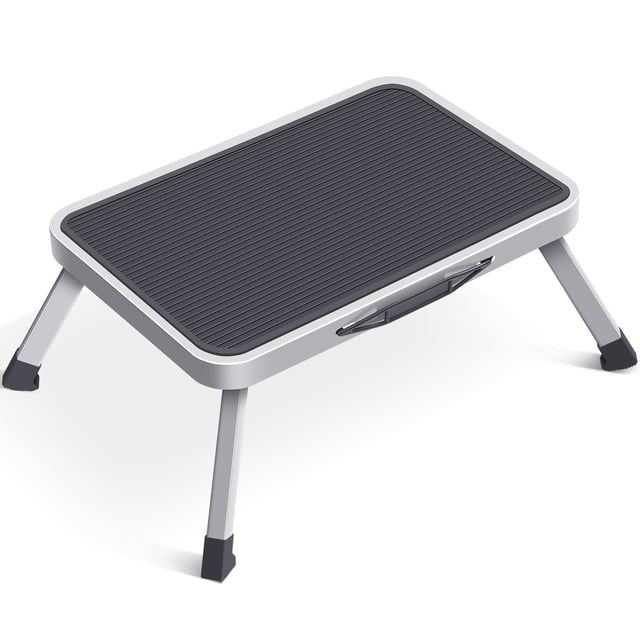 KK KINGRACK Metal Step Stool in gray with a folding design and anti-slip wide pedal. The stool features a durable steel frame with a weight capacity of 330 lbs (150 kg) and EN14183 certification. It includes spring locks on four feet for stability, rubber feet to prevent slipping, and a grooved anti-slip platform. The stool folds to a compact 4 cm thickness for easy storage and portability, weighing only 1.9 kg (4 lbs). Suitable for indoor and outdoor use, it can be used as a climbing tool for high cabinets, a footstool in the office, or an RV step.