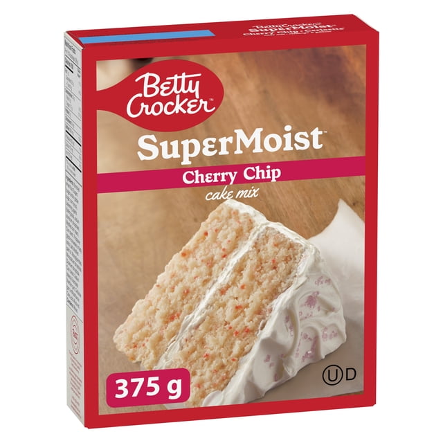 Betty Crocker Super Moist Cherry Chip Cake Mix box showing a front-facing red-bordered package with an image of a two-layer cherry chip cake slice with white frosting on a wooden surface, containing 375 g of mix ideal for easy baking and homemade-style desserts.