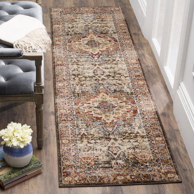 SAFAVIEH Bijar Orval Faded Traditional Area Rug with Kurdish-inspired motifs in earth tones and blue highlights, featuring a stain-resistant, non-shedding 0.3-inch pile, displayed as a runner on wood flooring beside a gray tufted bench and white window frames, ideal for classic or urban-chic spaces.