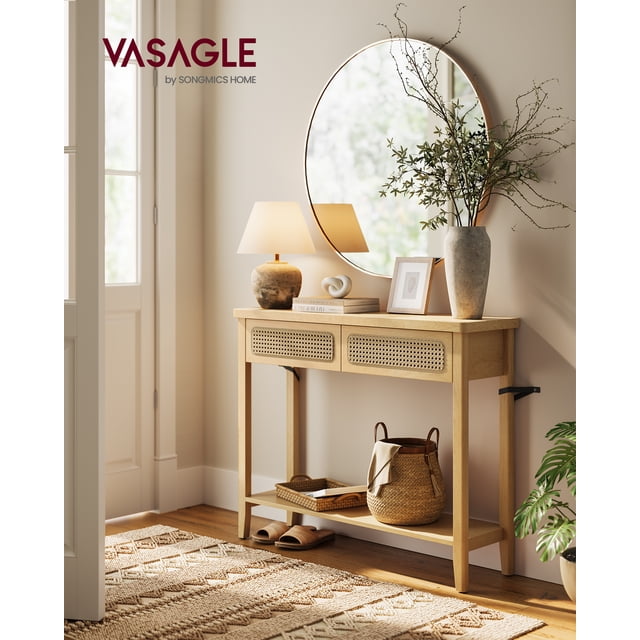 VASAGLE Console Table in oak beige with rounded corners, featuring an open storage shelf and two textured PVC rattan drawers. Made of MDF and particleboard, this versatile accent furniture blends boho and modern styles, ideal for entryways or living rooms. Decor items like a lamp, vase, and basket are displayed on its surface and shelf.