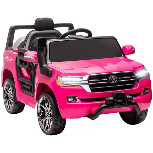 Qaba 12V Electric Car for Kids, Licensed Toyota Kids Electric RC Car in pink, designed as a Toyota LAND CRUISER. Features include built-in songs, USB port, FM radio, horn, and two headlights for realistic play. The car has a parent remote control for safety and three adjustable speeds. Suitable for children aged 37-72 months, with a weight capacity of 66 lbs. The car has four-wheel spring suspension, soft start, and a single rider seat.