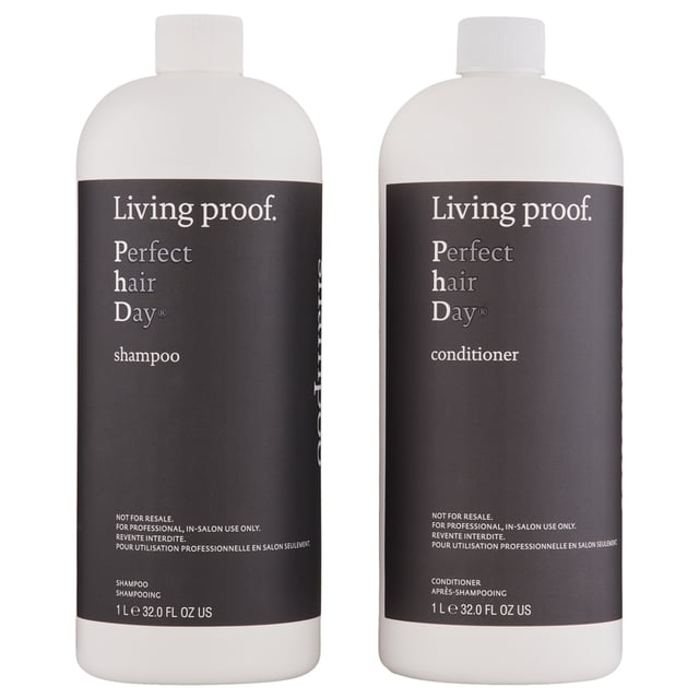Living Proof Perfect Hair Day Shampoo & Conditioner 32 oz set, featuring two white bottles with black labels. The shampoo and conditioner are sulfate-free, silicone-free, color-safe, and suitable for chemically treated hair. Designed to improve hair health over time and reduce the need for frequent washing.