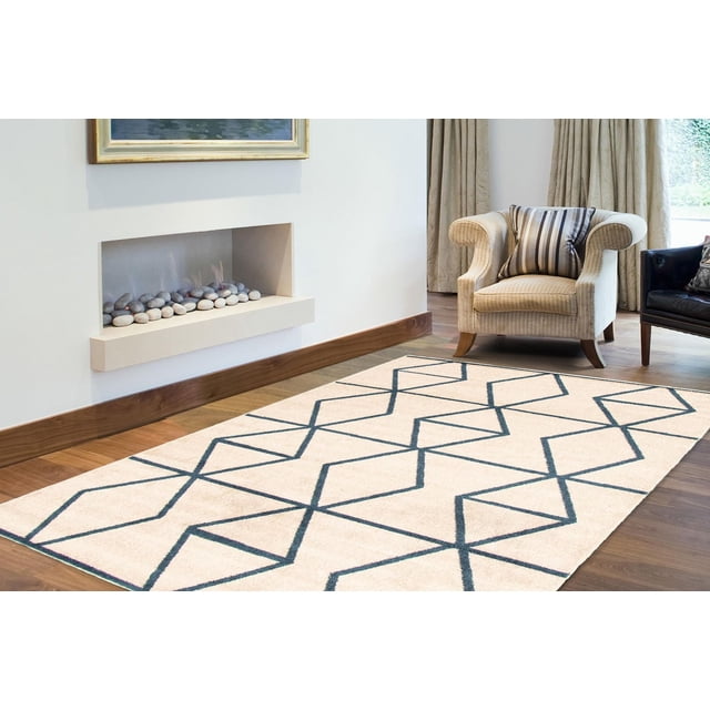 ECARPET Living Room Bedroom Carpet, Geometric Indoor Area Rug Ana Collection with beige base and dark blue geometric zigzag pattern, placed on hardwood floor in a living room with a beige armchair and built-in fireplace with decorative stones, suitable for adding texture and style to indoor spaces.