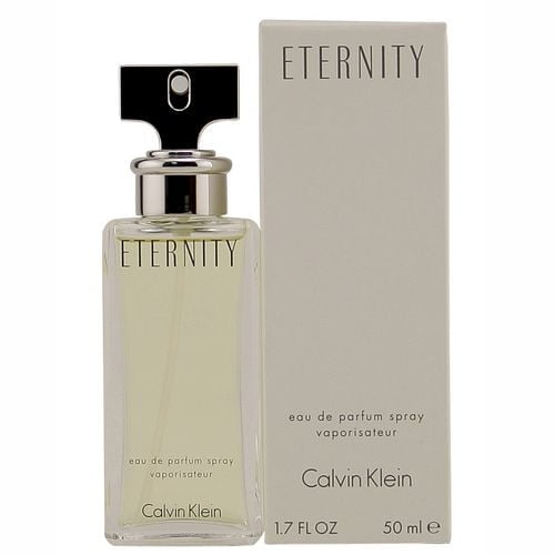 Eternity by Calvin Klein 50 mL eau de parfum spray for women with a classic romantic scent featuring white lily, violet, sage, freesia, mandarin, patchouli, and sandalwood, shown in a clear rectangular glass bottle with a silver spray cap next to its beige box.