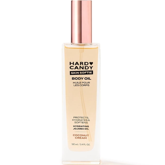 Hard Candy Nourishing Body Oil Coconut Cream in a clear rectangular bottle with rose gold cap, featuring hydrating jojoba oil and antioxidant-rich blend, moisturizing body oil for radiant skin, 100 ml.