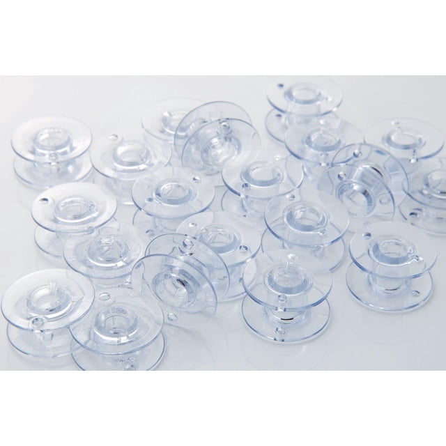 Brother Sewing Machine Bobbins made of clear plastic with a security notch, shown scattered on a white surface, compatible with multiple Brother sewing machine models, pack of 10 suitable for sewing and craft use.