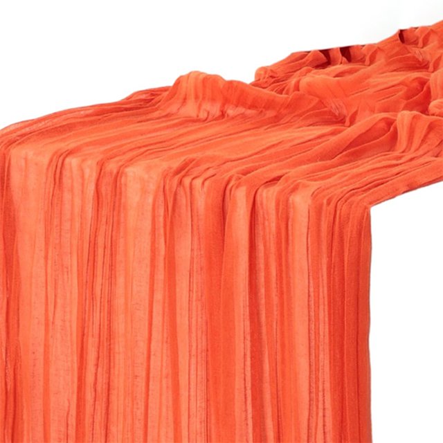 Semi-Sheer Gauze Table Runner Tablecloth Cheesecloth Dining Wedding Party Decor in a vibrant orange color, part of a multicolour collection. Made of soft polyester with a wrinkled texture, measuring approximately 90cm wide and 400cm long. Ideal for rustic-elegant table settings at weddings, parties, picnics, and other occasions.