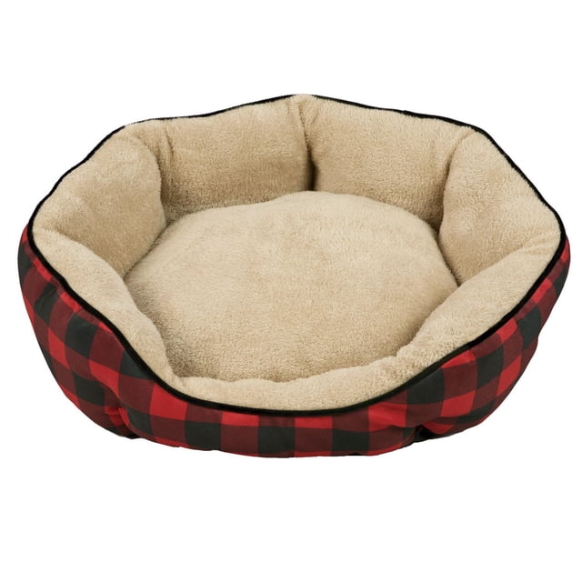 Canadiana Buffalo Plaid Medium Dog Bed with an oval shape, featuring a red and black buffalo plaid outer bolster and beige plush inner cushion and lining filled with soft polyfiber, suitable for medium dogs and often used as a cozy resting spot.