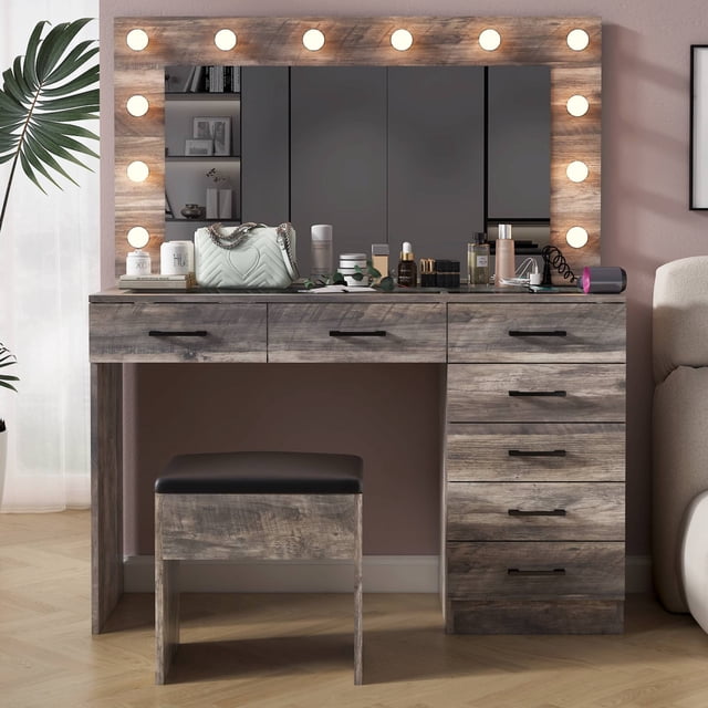 Ktaxon Large Makeup Vanity, Vanity Table Set with visible glass top and charging station in gray. This modern bedroom vanity features a seamless mirror with adjustable tri-color lighting, seven spacious drawers for organizing makeup and beauty tools, and a matching stool. Made of wood, ideal for adult use.
