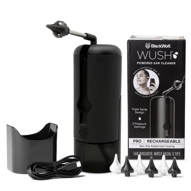 Wush Pro by Black Wolf deluxe water-powered ear cleaner in black, featuring a rubberized shell and rechargeable design. Includes an ear irrigator, water basin, six tips, and a USB charging cord. The product offers three pressure settings for safe and effective earwax removal, with a compact nozzle that folds for easy storage. Displayed alongside its packaging and accessories.