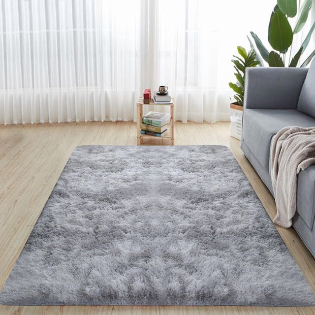 WRXMIJNHGSA Carpet Under $10 Indoor Modern Rugs Rugs Anti Washable Shaggy Area Rug in grey, displayed in a living room setting with a soft, fluffy texture. This washable area rug, made of polyester and flax, features a non-slip bottom and is suitable for living rooms, dining rooms, bedrooms, or other home spaces.