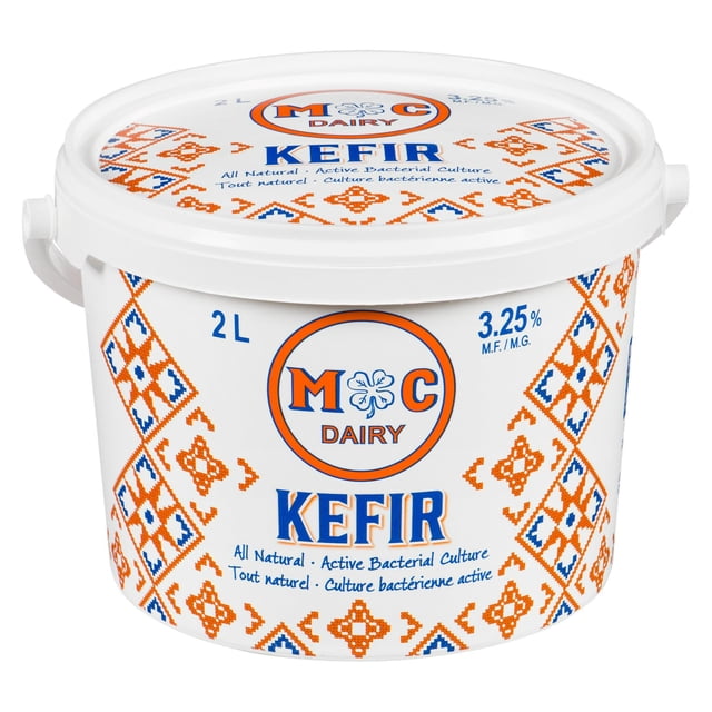 MC Dairy 3.25 % M.F. Kefir in a 2 L white plastic tub with handle, featuring orange and blue geometric patterns and MC Dairy logo. This all natural kefir contains active bacterial culture, made from 100% Canadian milk, and is a functional dairy yogurt drink often used for digestive health.