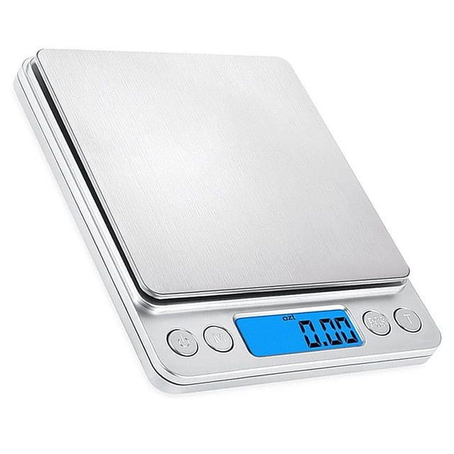 Balances de Cuisine Numériques avec une Plateforme en Acier Inoxydable, Dotées d'Un Écran LCD Rétroéclairé avec Grande Lecture Numérique. Conception Compacte de Balance Alimentaire avec Pieds Antidérapants pour la Stabilité, Mesures Précises jusqu'à 0,1 g et Capacité Maximale de 3 kg. Idéal pour la Cuisson et la Pâtisserie, avec des Fonctions Multifonctions comme la tare, la conversion d'Unité et la Mise hors Tension Automatique.