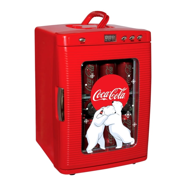 Coca-Cola Polar Bear 28 Can Cooler/Warmer 12V DC 110V AC Mini Fridge in vibrant red with polished chrome accents. This portable mini fridge features a tempered glass display window with iconic Coca-Cola polar bear graphics, bright LED interior lighting, and a self-locking door handle. Compact 25L design fits 28 cans, includes a removable shelf, and has a flip-up carry handle for portability. Offers dual power options and thermoelectric technology for cooling to 35°F below room temperature or warming to 140°F, ideal for home, office, dorm, or RV use.